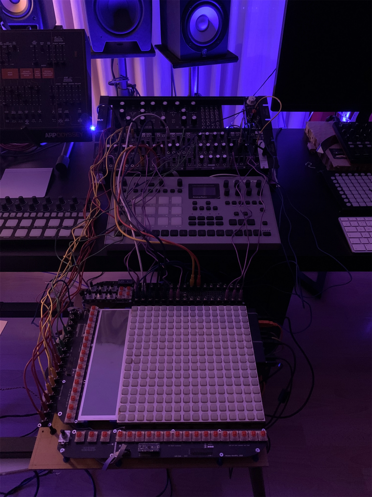 The first Reliq layout patched into a studio setup, with cables running over the screen