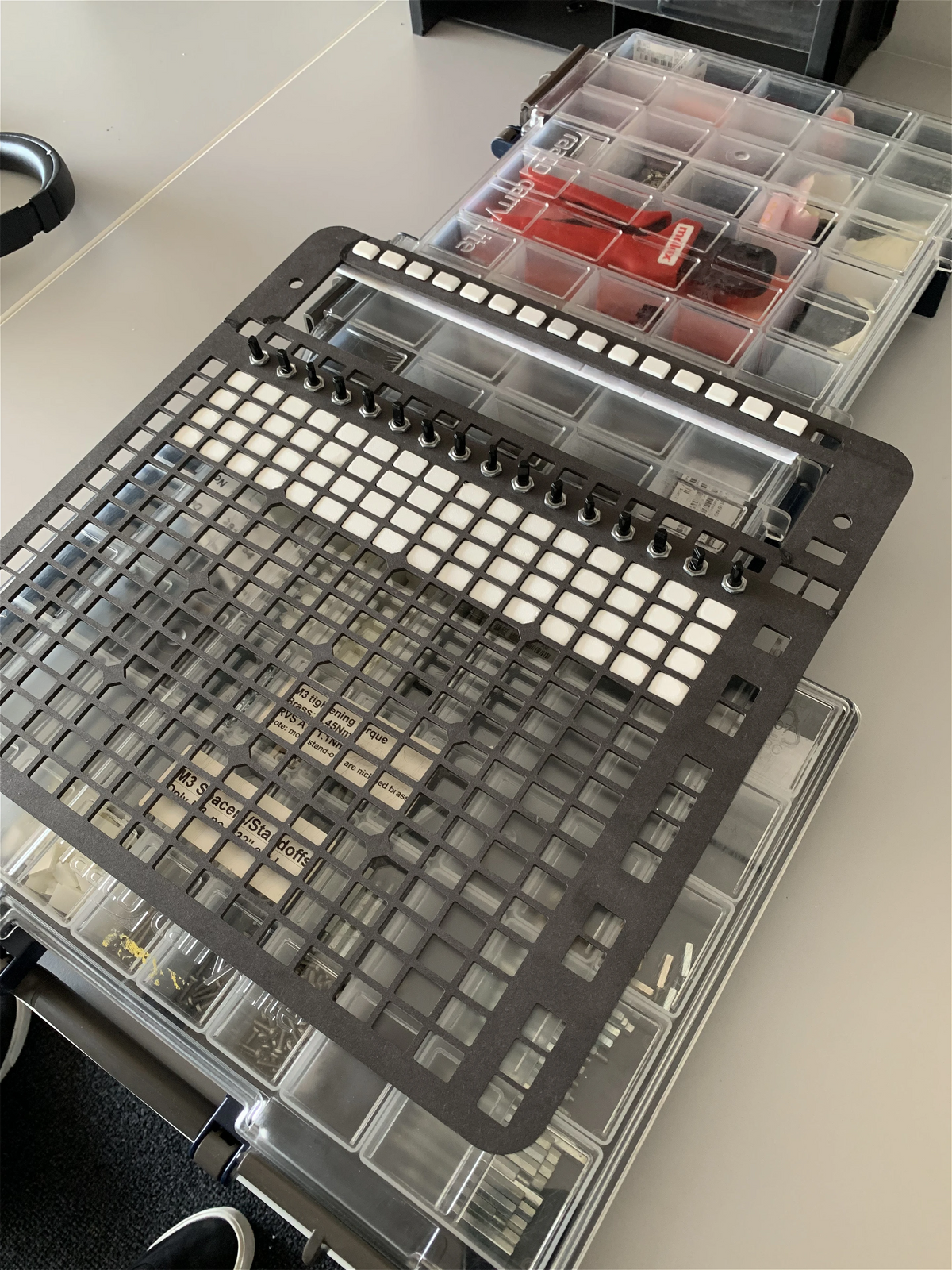 Metal mock-up plate with encoders and pads used to test spacing